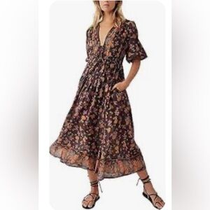 This is a Free People Lysette Maxi Dress in a chocolate combo floral pattern